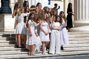 Group of graduating girls posing on the stairs